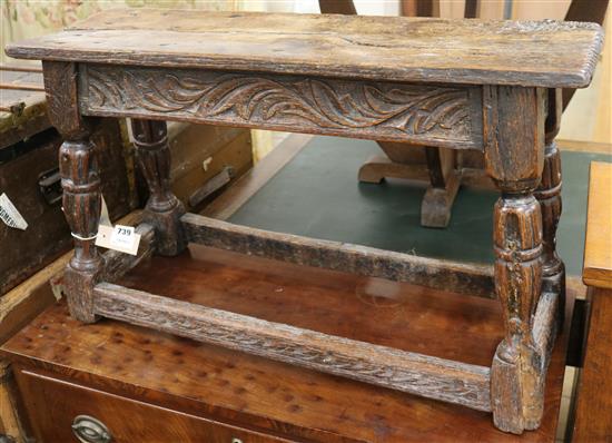 A 17th century style carved oak long stool, W.2ft 8in.